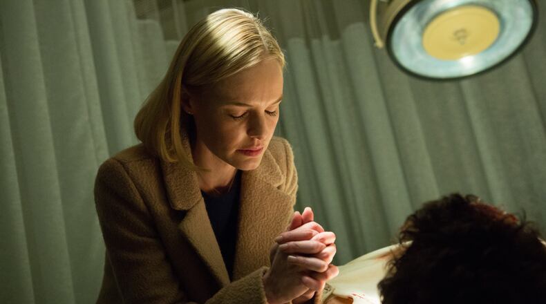 Kate Bosworth's character prays in a scene in locally filmed “90 Minutes in Heaven.” Photo credit: Quantrell Colbert