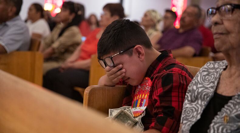 Thomas Ledesma cries during a Mass honoring the victims of the El Paso mass shooting, at El Buen Pastor Mission on the outskirts of El Paso, Texas, on Sunday, Aug. 11, 2019.
