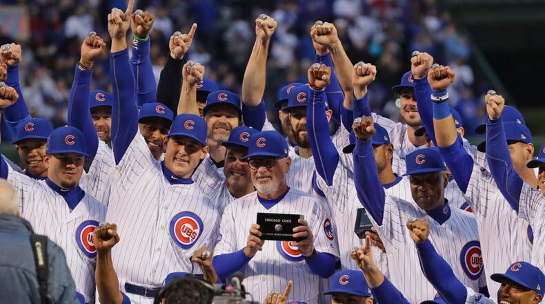 Members of the Chicago Cubs show off their World Series Championship rings before a game against the Los Angeles Dodgers at Wrigley Field on April 12, 2017 in Chicago, Illinois.  (Photo by Jonathan Daniel/Getty Images)