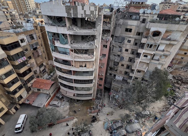 Damaged apartments building are seen after being struck earlier by an Israeli targeted attack in Dahiyeh, a southern suburb of Beirut, Lebanon, early Tuesday, April 1, 2025. (AP Photo/Hussein Malla)