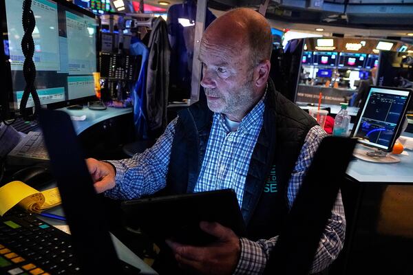 Trader Peter Mancuso works on the floor of the New York Stock Exchange, Friday, July 18, 2025. (AP Photo/Richard Drew)