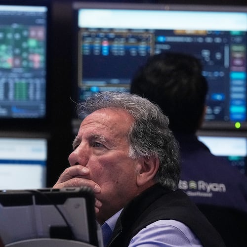 Trader Sal Suarino works on the floor of the New York Stock Exchange, Monday, Jan. 12, 2026. (AP Photo/Richard Drew)