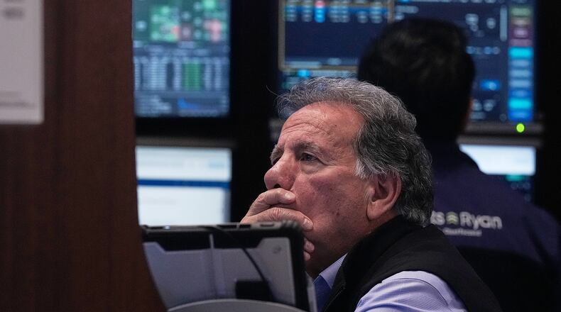 Trader Sal Suarino works on the floor of the New York Stock Exchange, Monday, Jan. 12, 2026. (AP Photo/Richard Drew)