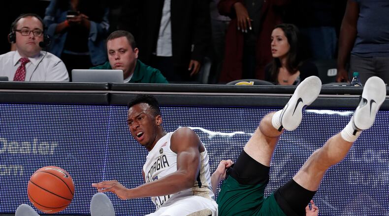 Georgia Tech guard Josh Okogie (5) and Ohio guard Gavin Block (22) fight for a loose ball in the first half of an NCAA college basketball game Friday, Nov. 18, 2016, in Atlanta. (AP Photo/John Bazemore)