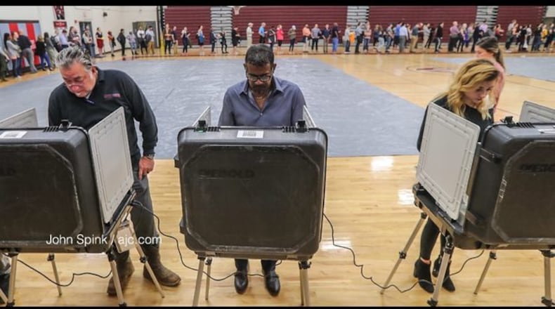 <p>Grady voters stand in a long line Tuesday&nbsp;</p> <p>Voters wait in line at Anniston Elementary in Gwinnett County on Election Day 2018.</p> <p>Voters at Grady</p> <p>Dr. Frank Lockwood was the first in line at Henry W. Grady High School at 29 Charles Allen Dr NE, in Atlanta on Tuesday Nov. 6, 2018. Metro Atlanta polling places reported steady lines as voters went to the polls Tuesday.&nbsp; JOHN SPINK/JSPINK@AJC.COM</p> <p>Voters wait in long lines at Helene S. Mills Senior Multipurpose Facility (BECCA GODWIN/AJC)</p> <p>Voters with umbrellas brave the rain in Smyrna</p> <p>Poll manager Melvin Davis Jr. At Grady</p> <p>Voters waiting in line before polled opened at 7 a.m. Tuesday.</p> <p>Voters at Burgess-Petersen Academy in East Atlanta</p> <p>Voters at Burgess-Petersen Academy in East Atlanta</p> <p>Voters at Burgess-Petersen Academy in East Atlanta</p> <p>Voters early Tuesday morning in east Cobb County</p>
