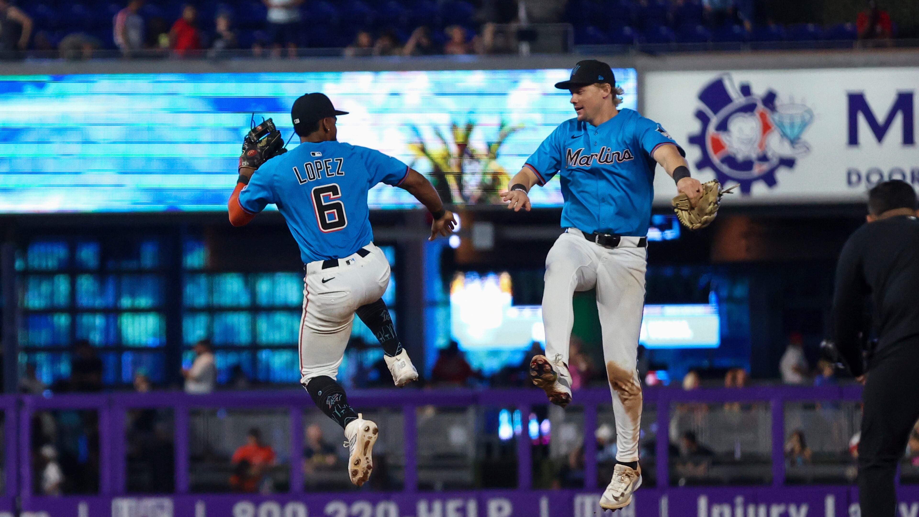 Miami Marlins' Otto Lopez and Kyle Stowers celebrate after beating Braves on Sunday. (Chris Arjoon/AP)