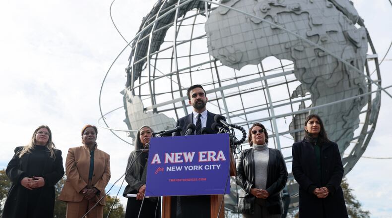 New York City mayor-elect Zohran Mamdani, center, speaks in front of the Unisphere alongside his transition team, from left, Elana Leopold, Melanie Hartzog, Maria Torres-Springer, Grace Bonilla, and Lina Khan, in the Queens borough of New York, Wednesday, Nov. 5, 2025. (AP Photo/Heather Khalifa)