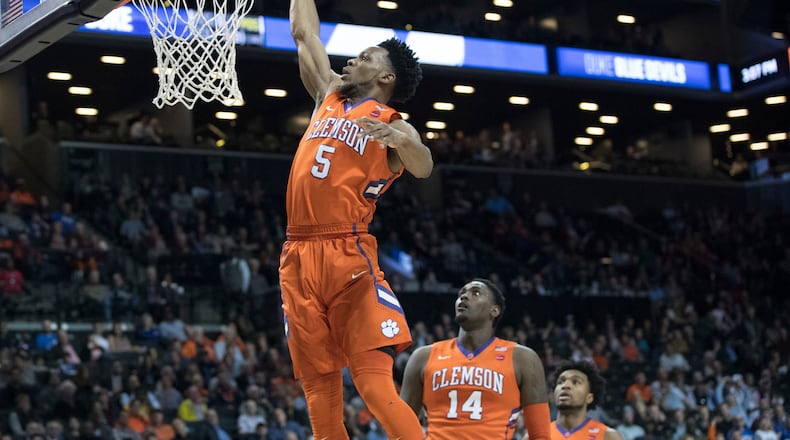 Clemson forward Jaron Blossomgame (5) dunks during the first half of an NCAA college basketball game against Duke in the Atlantic Coast Conference tournament, Wednesday, March 8, 2017, in New York. (AP Photo/Mary Altaffer)