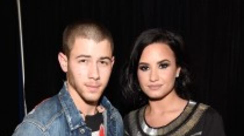 Nick Jonas and Demi Lovato pose for a photo backstage in Atlanta. (Photo by Kevin Mazur/Getty Images for Philly Mack)