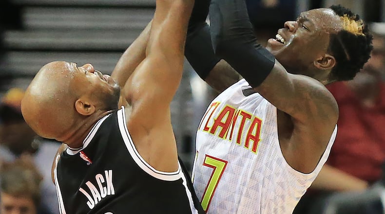 110415 ATLANTA: -- Hawks Dennis Schroder shoots over Nets Jarrett Jack during the second half in a basketball game on Wednesday, Nov. 4, 2015 in Atlanta. The Hawks beat the Nets 101-87 for their fifth straight win. Curtis Compton / ccompton@ajc.com