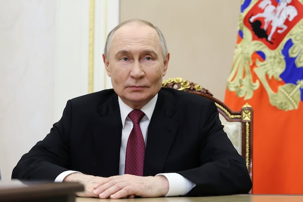 Russian President Vladimir Putin delivers a congratulatory message on the occasion of the 100th anniversary of the publication of the first issue of Komsomolskaya Pravda newspaper, in Moscow, Russia, Saturday, May 24, 2025. (Alexander Kazakov, Sputnik, Kremlin Pool Photo via AP)