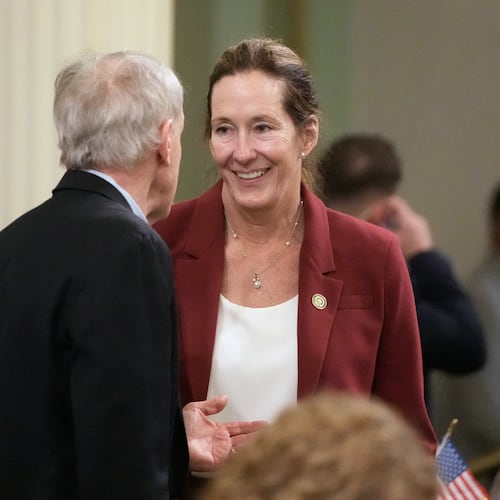 Assemblymember Jacqui Irwin, right, talks with Assemblymember Steve Bennett during an Assembly session at the Capitol, Monday, Aug. 31, 2026, in Sacramento, Calif. (AP Photo/Jeff Chiu)