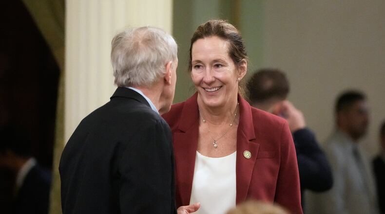 Assemblymember Jacqui Irwin, right, talks with Assemblymember Steve Bennett during an Assembly session at the Capitol, Monday, Aug. 31, 2026, in Sacramento, Calif. (AP Photo/Jeff Chiu)