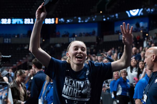 UConn guard Paige Bueckers leaves the court after a game against Southern California in the Elite Eight of the NCAA college basketball tournament Monday, March 31, 2025, in Spokane, Wash. (AP Photo/Jenny Kane)