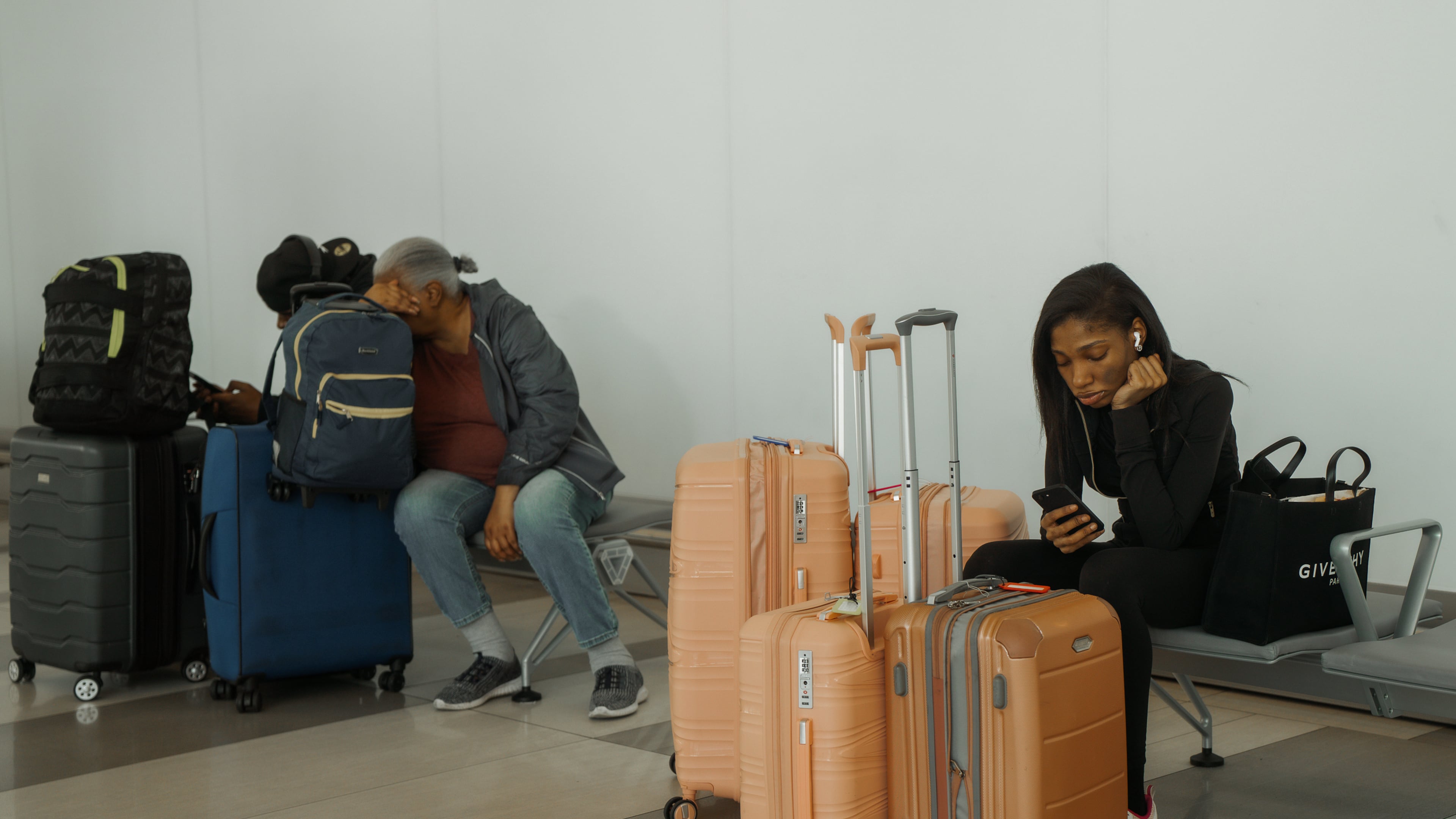 Travelers wait at LaGuardia International Airport on Saturday, Nov. 8, 2025, in New York. (AP Photo/Olga Fedorova)