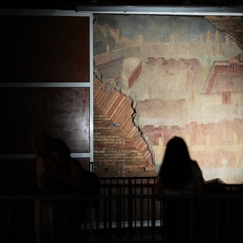 Reporters film the "The Painted City" fresco, discovered during 1990s built as foundations for the Baths of Trajan that has been restored, in Rome, Tuesday, Sept. 8, 2026.(AP Photo/Andrew Medichini)