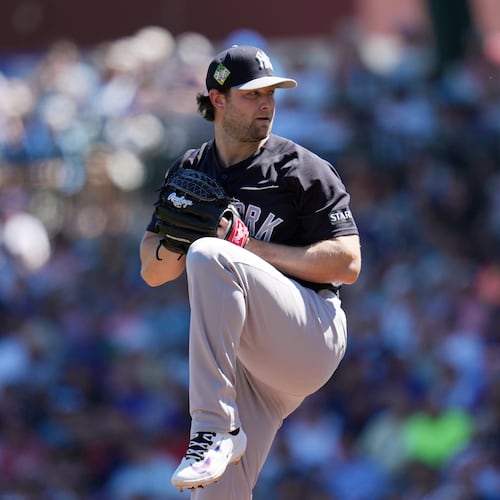 FILE - New York Yankees starting pitcher Gerrit Cole throws against the Chicago Cubs during the first inning of a spring training baseball game, Tuesday, March 24, 2026, in Mesa, Ariz. (AP Photo/Ross D. Franklin, File)