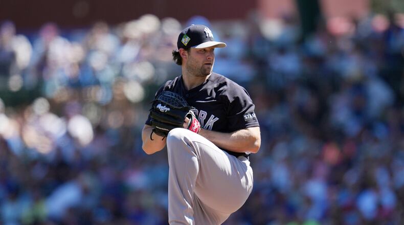 FILE - New York Yankees starting pitcher Gerrit Cole throws against the Chicago Cubs during the first inning of a spring training baseball game, Tuesday, March 24, 2026, in Mesa, Ariz. (AP Photo/Ross D. Franklin, File)