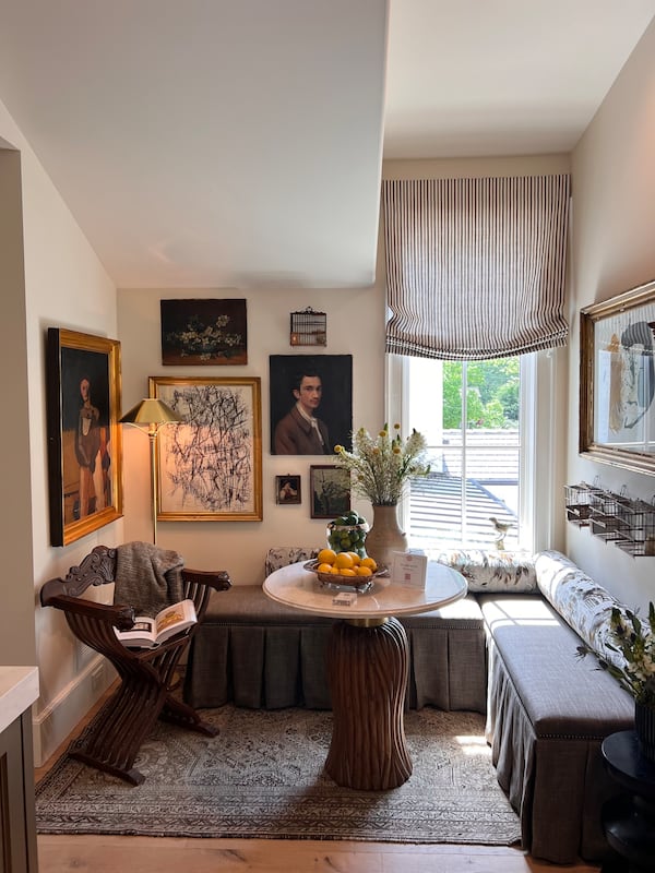 Brown elements can be brought into the home with paint, wallpaper and furniture, but also in subtler ways through art and picture frames as in this in-law suite lounge created by Frederick Morelli at UpCountry Home. (Courtesy of UpCountry Home)