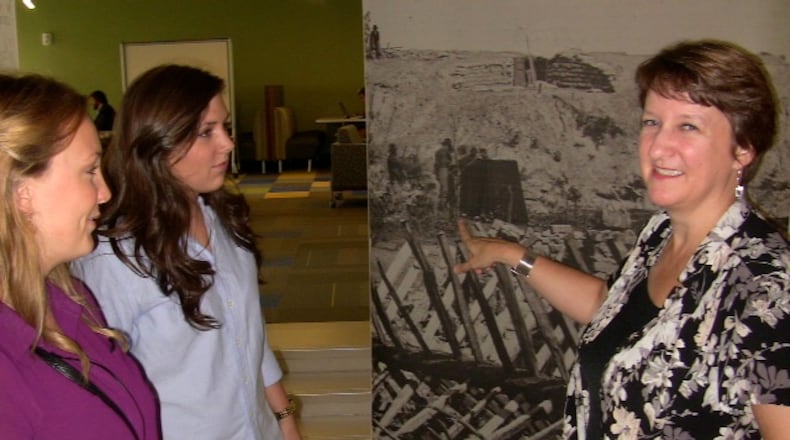 Georgia Tech architecture Prof. Laura Hollengreen and two of her grad students, Clara Winston (left) and Ashlynne Bauer check out the landscape of a Civil War fort located in 1864 at the southwestern corner of today s campus.