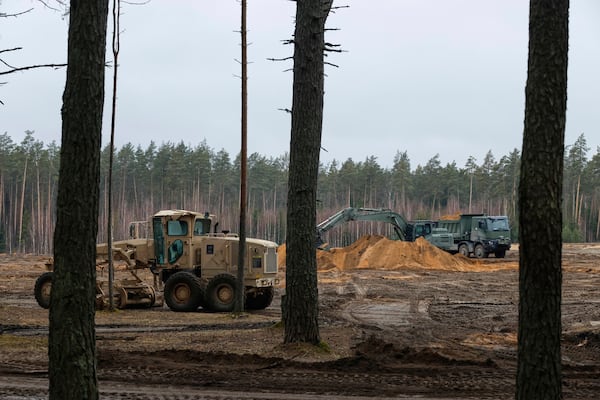 Military road equipment seen working at a training range in Pabrade, north of the capital Vilnius, Lithuania on Thursday, March 27, 2025. (AP Photo/Mindaugas Kulbis)