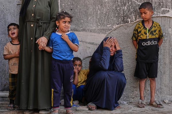 Relatives of Palestinians killed in Israeli strikes on the Gaza Strip mourn their deaths at Shifa Hospital in Gaza City, Saturday, June 28, 2025. (AP Photo/Jehad Alshrafi)