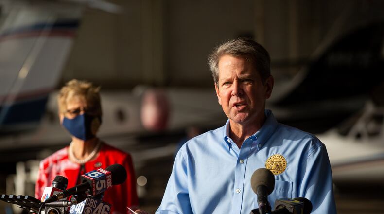 Georgia Gov. Brian Kemp and Georgia Department of Public Health (DPH) Commissioner Dr. Kathleen Toomey speak at the Peachtree Dekalb Airport in Atlanta, Georgia, on Thursday, July 1, 2020. Governor Kemp and Georgia Department of Public Health (DPH) Commissioner Dr. Kathleen Toomey will take part in a “Wear a Mask” Flyaround Tour of Georgia, encouraging Georgians to follow the guidance of public health officials to stop the spread of COVID-19 ahead of the 4th of July Weekend. (REBECCA WRIGHT FOR THE ATLANTA JOURNAL-CONSTITUTION)