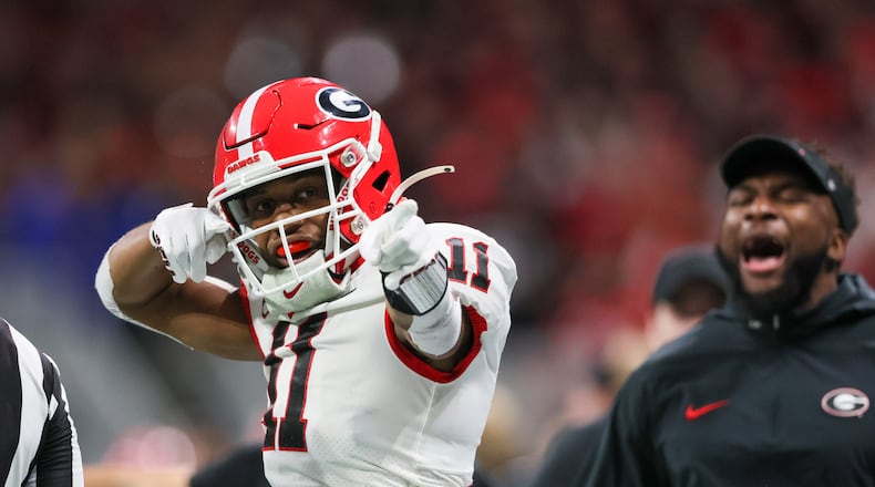 Georgia Bulldogs wide receiver Arian Smith (11) celebrates a catch against the Alabama Crimson Tide during the second half of the SEC Championship football game at the Mercedes-Benz Stadium in Atlanta, on Saturday, December 2, 2023. (Jason Getz / Jason.Getz@ajc.com)