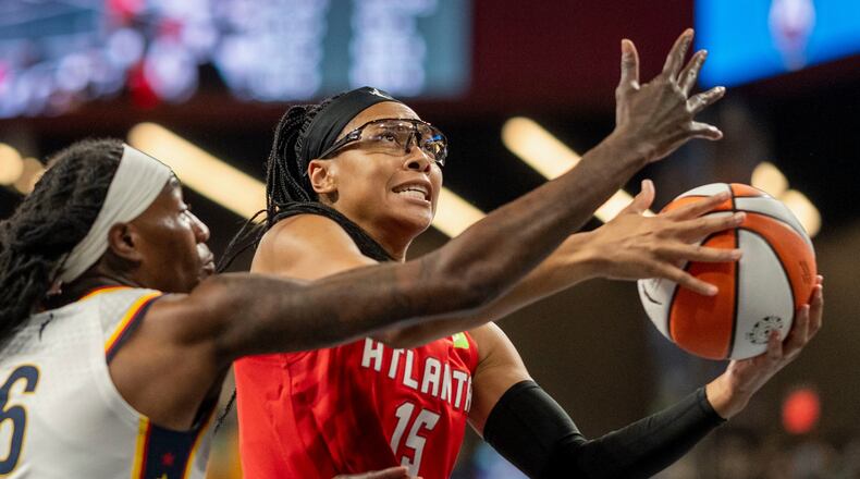 FILE - Atlanta Dream guard Allisha Gray (15) attempts a basket against Indiana Fever forward Natasha Howard (6) during the first half of Game 1 in the first round of the WNBA basketball playoffs, Sep. 14, 2025, in Atlanta. (AP Photo/Erik Rank, File)