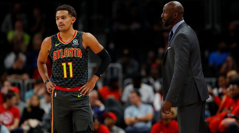 Coach Lloyd Pierce of the Hawks converses with Trae Young against the Chicago Bulls at State Farm Arena on November 06, 2019 in Atlanta, Georgia. (Photo by Kevin C. Cox/Getty Images)