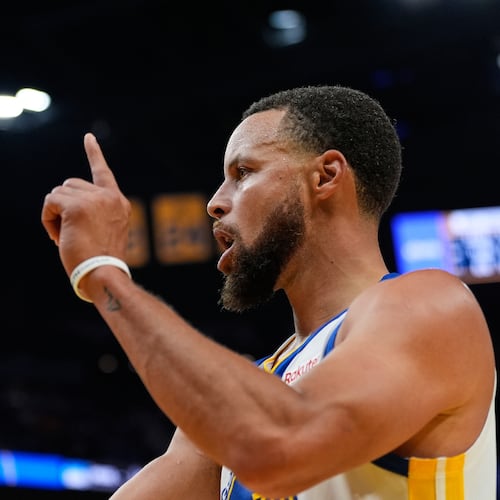 Golden State Warriors guard Stephen Curry reacts after scoring during the second half of an NBA basketball game against the Denver Nuggets, Thursday, Oct. 23, 2025, in San Francisco. (AP Photo/Godofredo A. Vásquez)