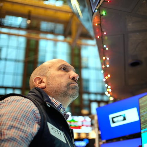 James Denaro works on the floor at the New York Stock Exchange in New York, Wednesday, Dec. 10, 2025. (AP Photo/Seth Wenig)