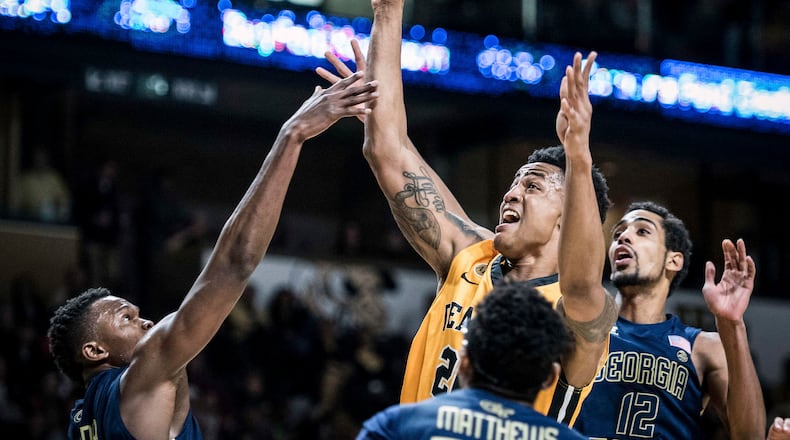 Wake Forest forward John Collins (20) shoots over Georgia Tech forward Sylvester Ogbonda (24) during an NCAA college basketball game Saturday, Feb. 4, 2017, in Winston-Salem, N.C. (Allison Lee Isley/The Winston-Salem Journal via AP)