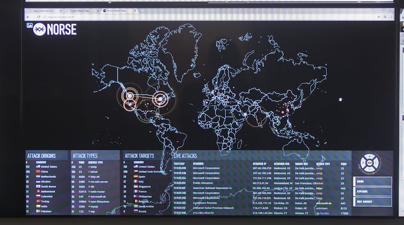 The Norse Attack Map shows the locations of targets and attackers for online attacks worldwide. (CASEY SYKES, CASEY.SYKES@AJC.COM)
