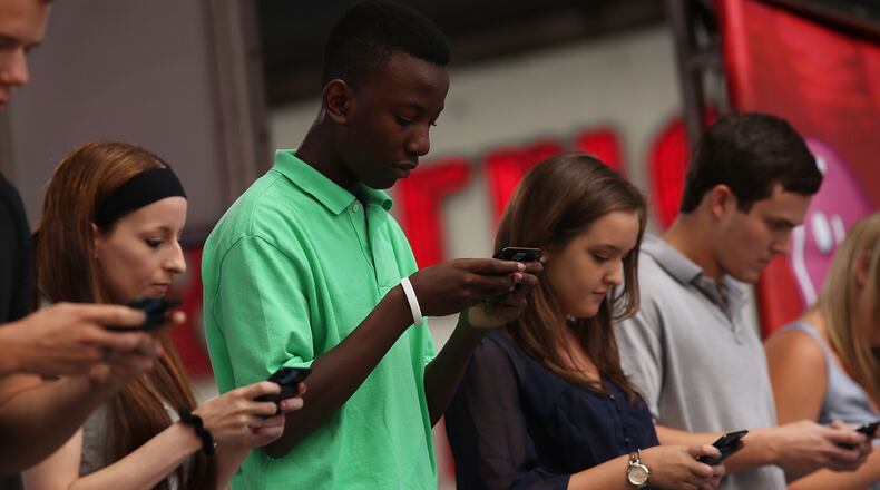 NEW YORK, NY - AUGUST 08: Contestants in the Sixth Annual LG Mobile U.S. National Texting Championships compete on stage on August 8, 2012 in New York City. This years winner was again Austin Wierschke who took home $50,000. (Photo by Spencer Platt/Getty Images)