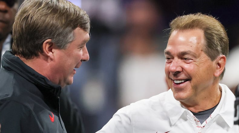Georgia Bulldogs head coach Kirby Smart and Alabama Crimson Tide head coach Nick Saban get together before the SEC Championship football game at the Mercedes-Benz Stadium in Atlanta, on Saturday, December 2, 2023. (Jason Getz / Jason.Getz@ajc.com)