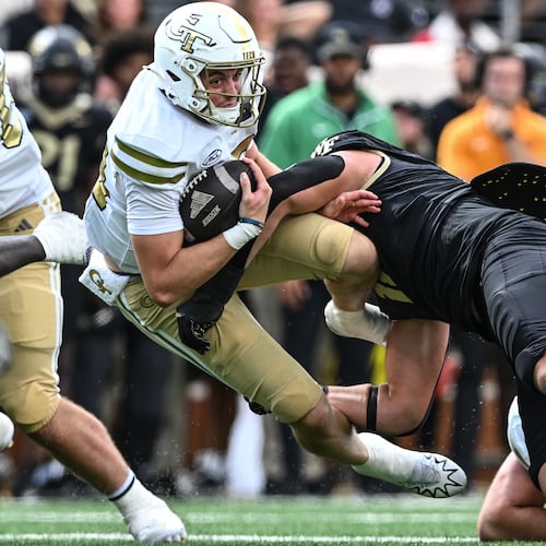 Georgia Tech quarterback Haynes King (10) is tackled by Wake Forest defensive lineman Gabe Kirschke (10) during the second half of an NCAA college football game, Saturday, Sept. 27, 2025, in Winston-Salem, N.C. (AP Photo/Matt Kelley)