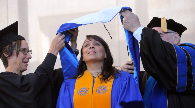 Former U.S. Poet Laureate Natasha Tretheway receives an honorary degree before her keynote address at Emory University's 2017 commencement.