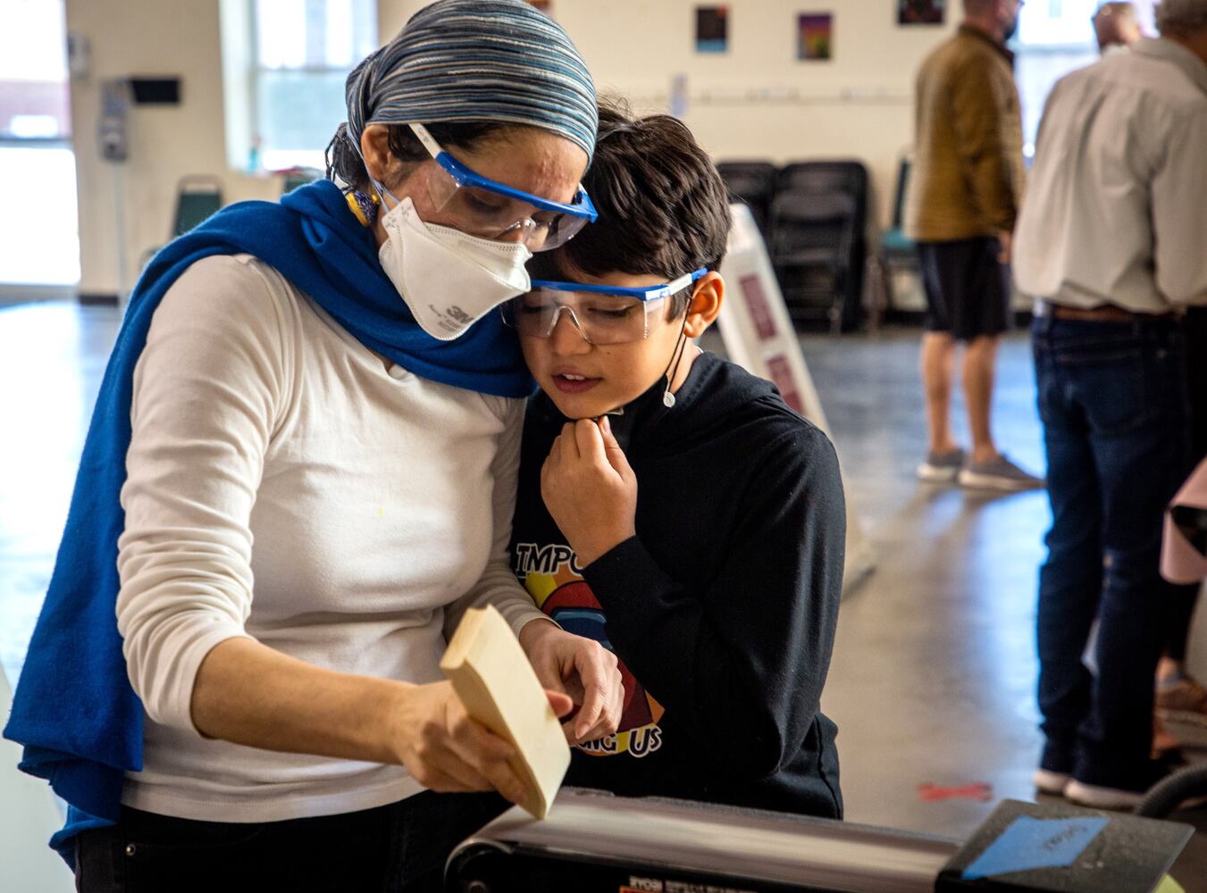 Cub Scouts building pinewood derby cars