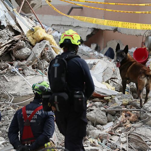 Firefighters search through rubble two days after an earthquake struck Cali, Colombia, Wednesday, Aug. 12, 2026. (AP Photo/Santiago Saldarriaga)