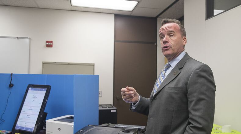Chris Harvey, director of elections for the Georgia secretary of state, shows Georgia’s new voting machines during a demonstration at the James H. Floyd Building in Atlanta. (Alyssa Pointer/alyssa.pointer@ajc.com)