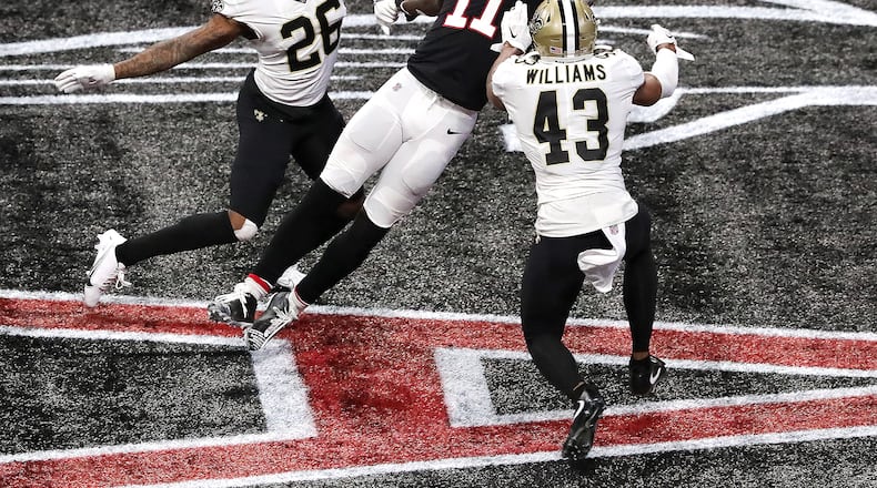 ***** VISUAL LEDE ***** 120620 ATLANTA: In what would have been the go-ahead touchdown in the final 2 minutes Atlanta Falcons wide receiver Julio Jones can’t haul in the fourth down attempt from Matt Ryan in the endzone as the ball goes off his fingertips with New Orleans Saints cornerback P.J. Williams (left) and safety Marcus Williams (right) defending during the 4th quarter in a NFL football game on Sunday, Dec. 6, 2020, in Atlanta. The Saints beat the Falcons 21-16. “Curtis Compton / Curtis.Compton@ajc.com”