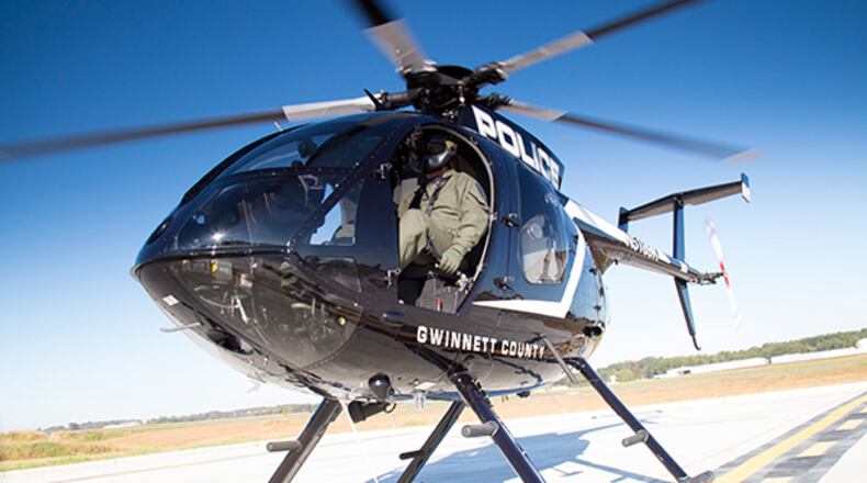 A man is accused of pointing a laser at a Gwinnett Police Department helicopter.