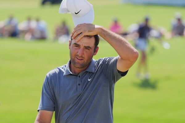 Scottie Scheffler reacts after finishing on the 18th hole during the final round of the Charles Schwab Challenge golf tournament at Colonial Country Club in Fort Worth, Texas, Sunday, May 25, 2025. (AP Photo/LM Otero)