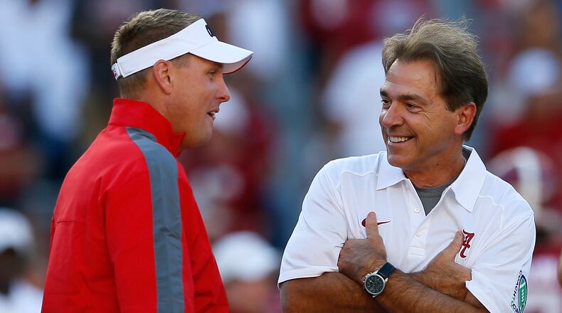 Mississippi head coach Hugh Freeze talks with Alabama's Nick Saban prior to their game at Bryant-Denny Stadium on Sept. 28, 2013, in Tuscaloosa, Ala.