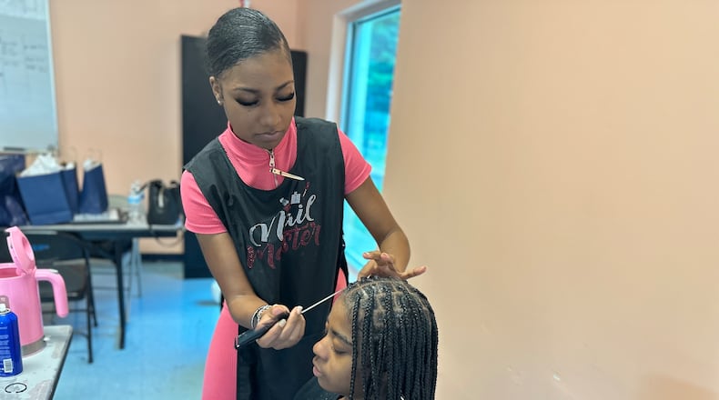 Before school started, volunteer braiders offered their services for free to girls in foster care. Courtesy