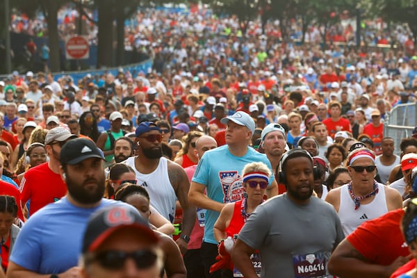 Runner begin their race just after the starting line during the 57th running of the Peachtree Road Race on Saturday, July 4, 2026, in Atlanta. (Arvin Temkar/AJC)
