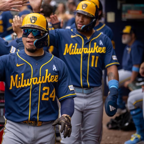 Milwaukee Brewers' William Contreras (24) celebrates after batting in three runs during the second inning of a baseball game against the Atlanta Braves, Sunday, June 21, 2026, in Atlanta. (AP Photo/Erik Rank)