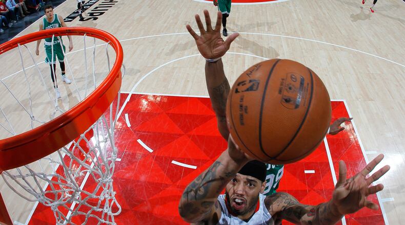 Mike Scott of the Atlanta Hawks battles under the basket against the Boston Celtics in Game Five of the Eastern Conference Quarterfinals during the 2016 NBA Playoffs at Philips Arena on April 26, 2016 in Atlanta, Georgia. (Photo by Kevin C. Cox/Getty Images)