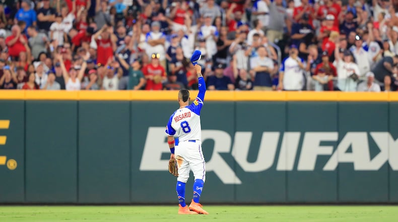 Braves left fielder Eddie Rosario waves to the left field fans as they give him a standing ovation after he hit a go-ahead two-run home run during the Saturday evening MLB game between the San Francisco Giants and the Atlanta Braves on Aug.19, 2023 at Truist Park in Atlanta, Georgia. (Photo by David J. Griffin/Icon Sportswire) (Icon Sportswire via AP Images)